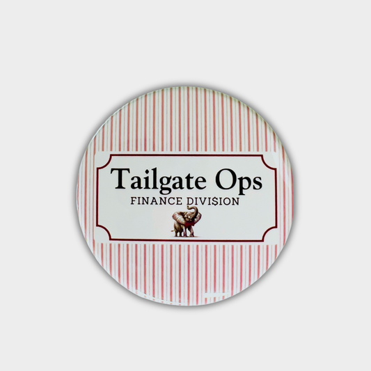 Round button with 'Tailgate Ops Finance Division' text and an elephant graphic on a red and white striped background.