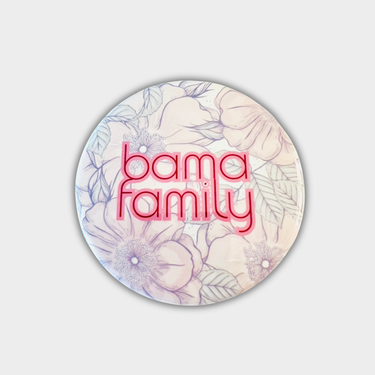 Round button with 'bama family' text on a floral background