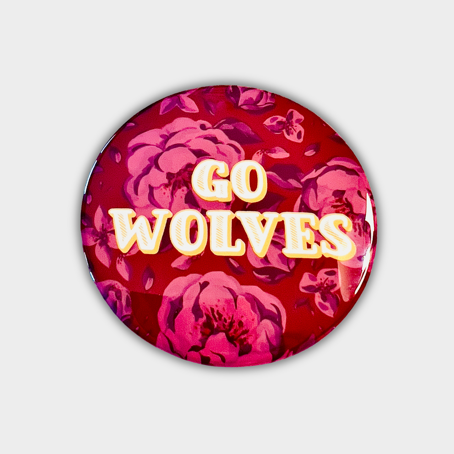 Northern State Go Wolves button with subtle red floral background and gold text, 3-inch pin