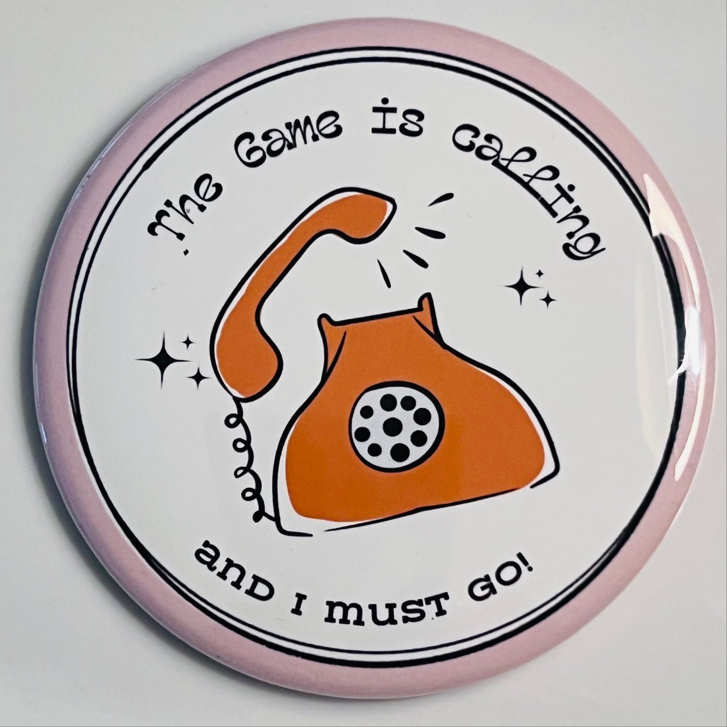 Round button with a vintage phone illustration and text on a white background