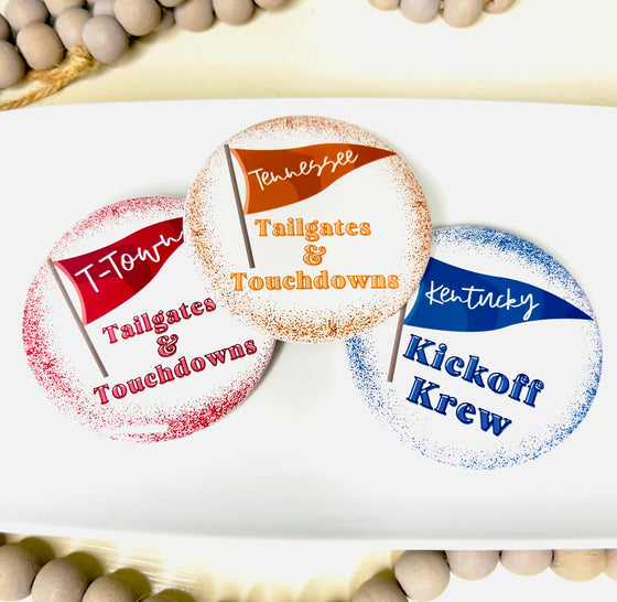 Three round buttons with football-themed pennants on white background.