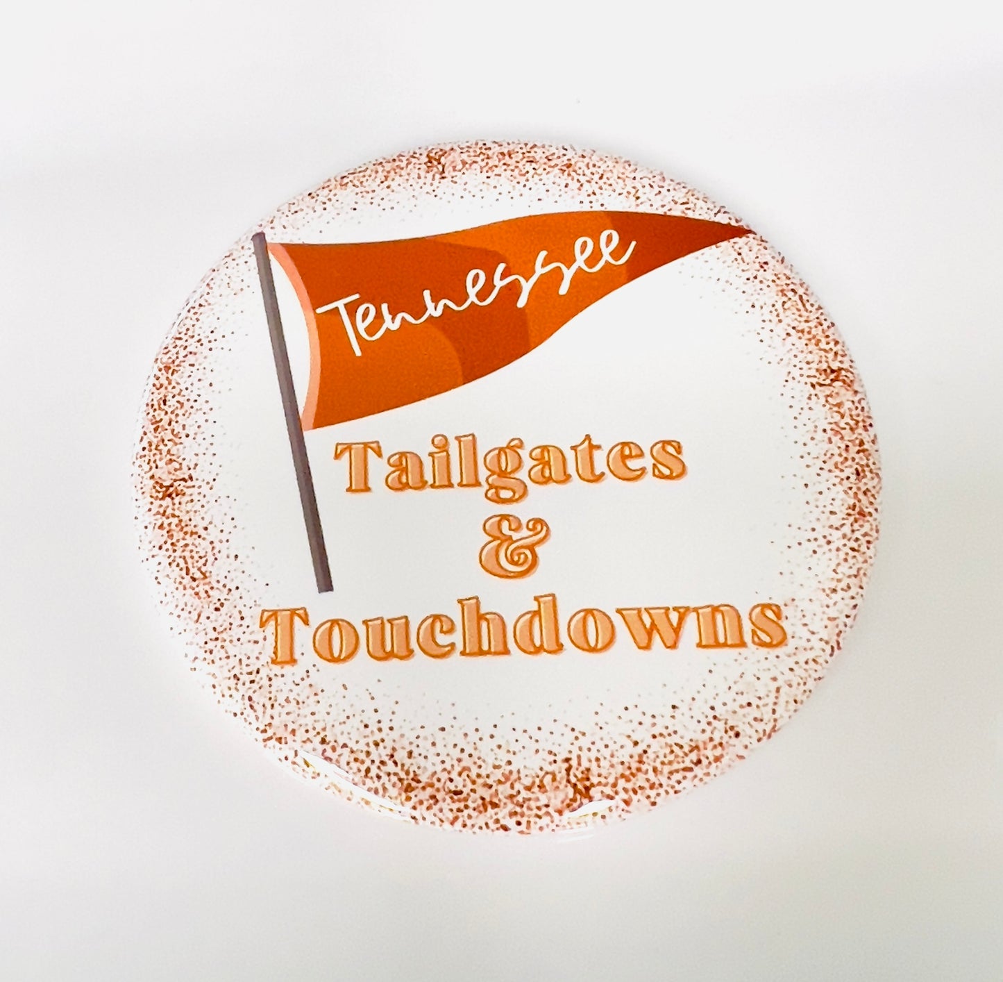 Round button with orange Tennessee flag design and text 'Tennessee Tailgates & Touchdowns' on a white background.