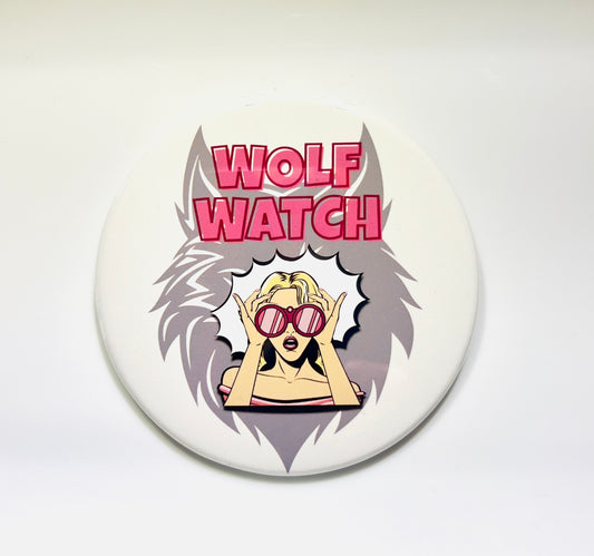 Button badge with 'Wolf Watch' text and cartoon character on a white background
